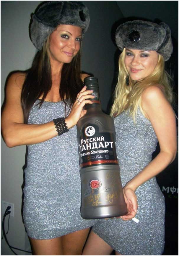 two gril with bottle of liquor